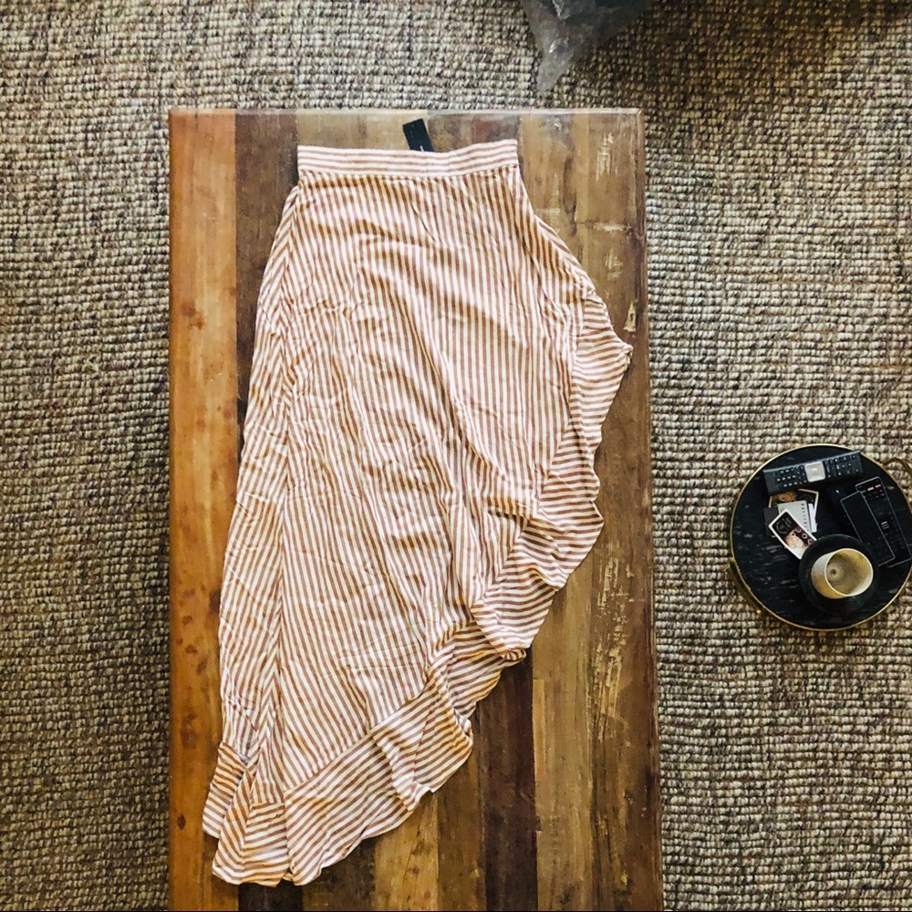 White and tan asymmetrical skirt.
